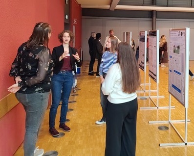 Persons discussing their posters